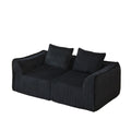 Minimalist Sofa With Curved Lines And Horn Shaped Throw Pillows