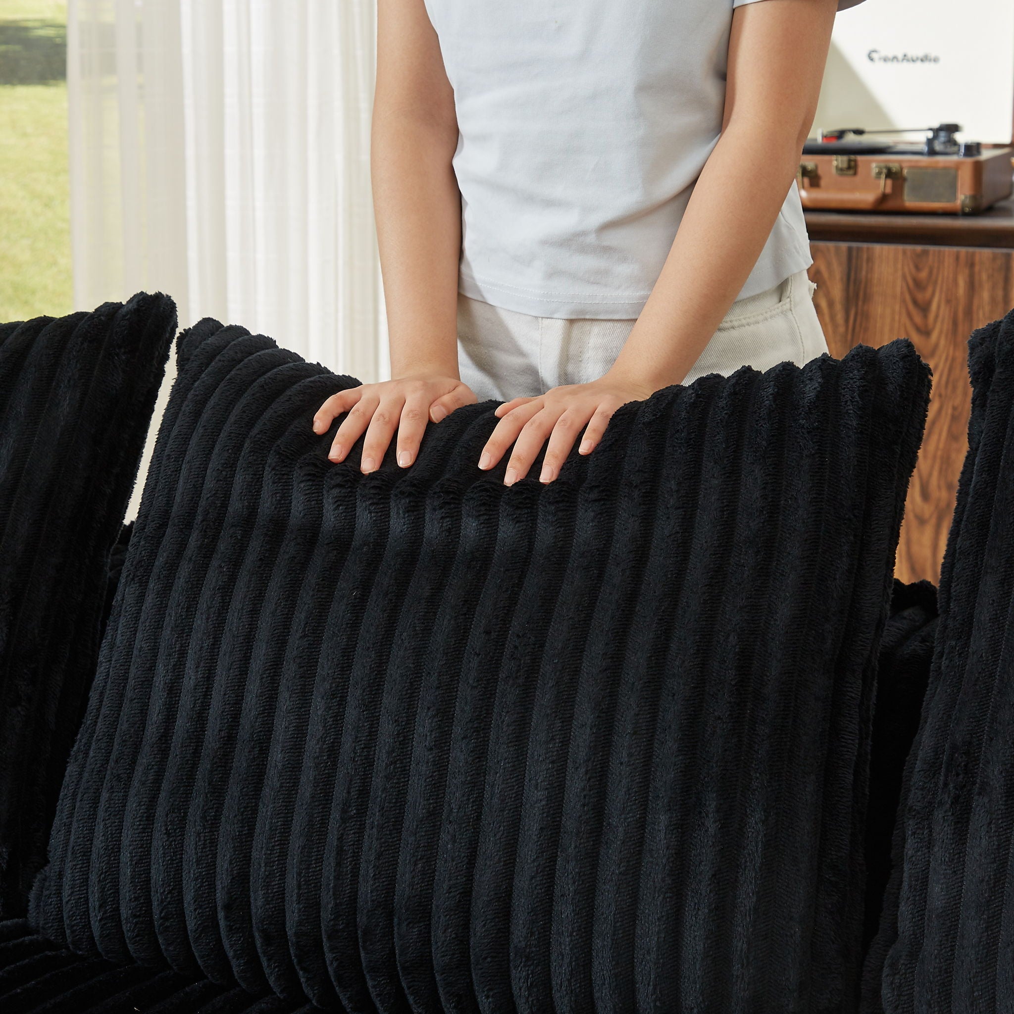 Minimalist Sofa With Curved Lines And Horn Shaped Throw Pillows